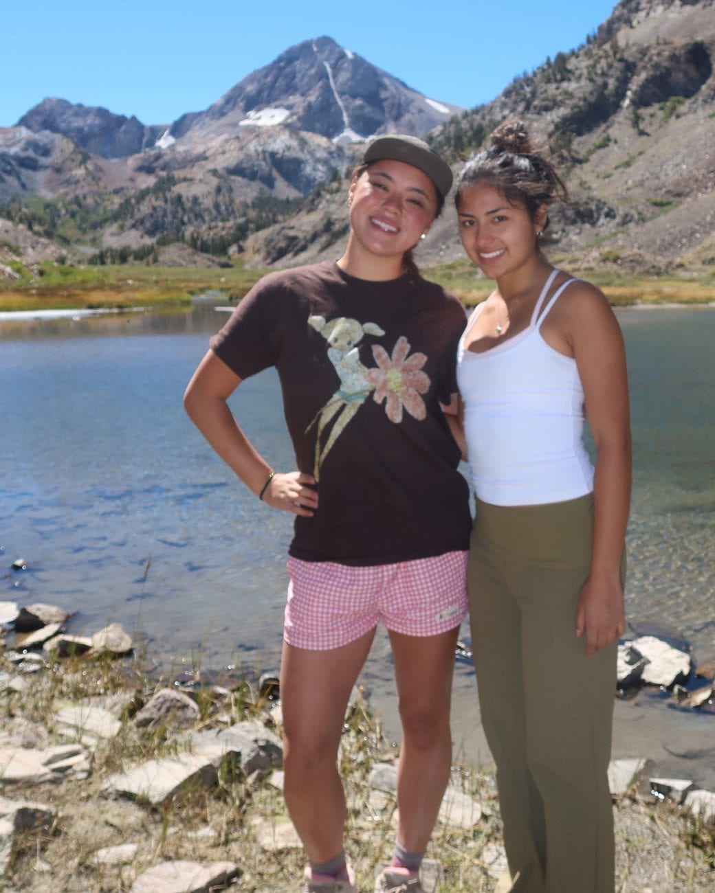 Rachel and Cheyenne, Tualmi's founders, beside an alpine lake